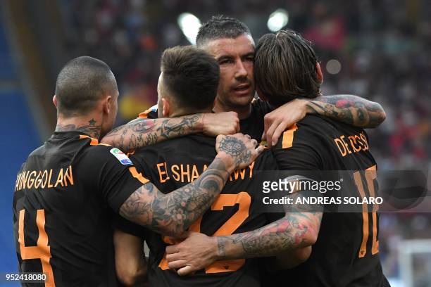 Roma's Italian striker Stephan El Shaarawy celebrates with teammates after scoring a goal during the Italian Serie A football match between Roma and...