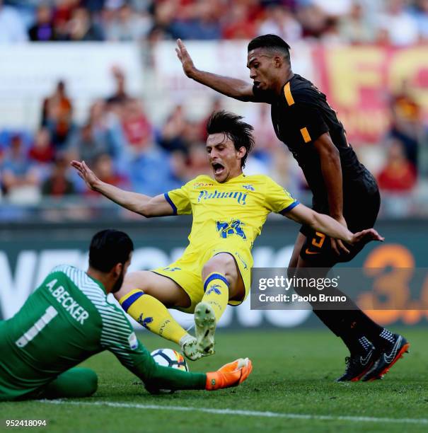 Juan Jesus and Alisson Becker of AS Roma compete for the ball with Roberto Inglese of AC Chievo Verona during the serie A match between AS Roma and...