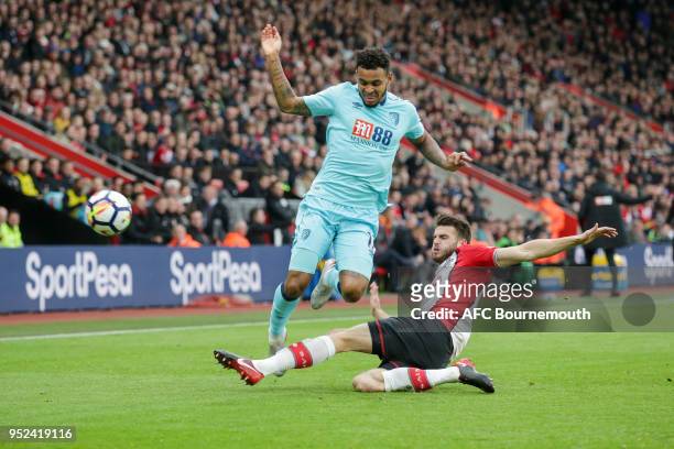 Joshua King of Bournemouth and Wesley Hoedt of Southampton during the Premier League match between Southampton and AFC Bournemouth at St Mary's...