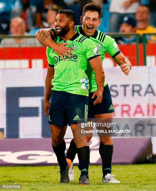 Highlanders' fly-half Lima Sopoaga and New Zealand lock Rob Thompson celebrate after winning the SUPERXV Rugby match between Bulls and Highlanders at...