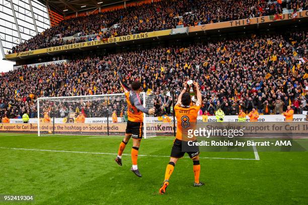 Ruben Neves of Wolverhampton Wanderers celebrates with the fans with the trophy during the Sky Bet Championship match between Wolverhampton Wanderers...