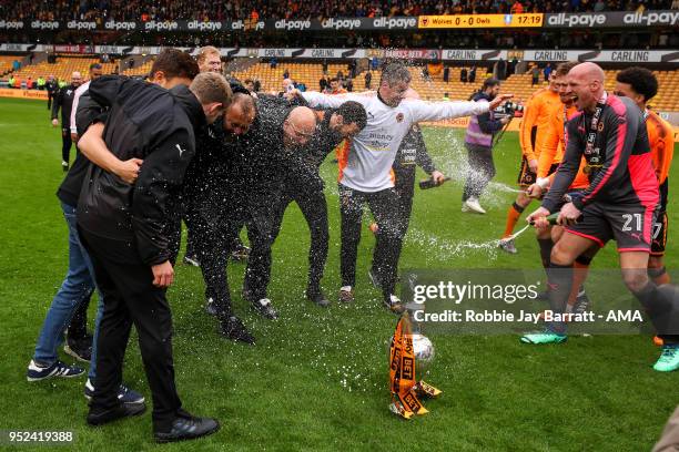 John Ruddy of Wolverhampton Wanderers sprays champagne on Nuno Espirito Santo head coach / manager of Wolverhampton Wanderers during the Sky Bet...