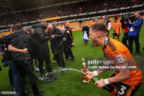 Barry Douglas of Wolverhampton Wanderers sprays champagne on Nuno Espirito Santo head coach / manager of Wolverhampton Wanderers during the Sky Bet...