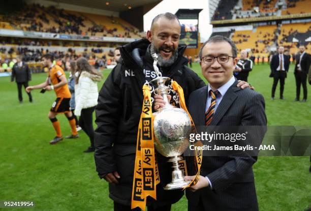 Nuno Espirito Santo manager / head coach of Wolverhampton Wanderers and chairman Jeff Shi celebrate with the EFL Sky Bet Championship trophy after...