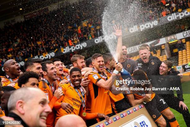 Wolverhampton Wanderers players celebrate winning the EFL Sky Bet Championship during the Sky Bet Championship match between Wolverhampton Wanderers...