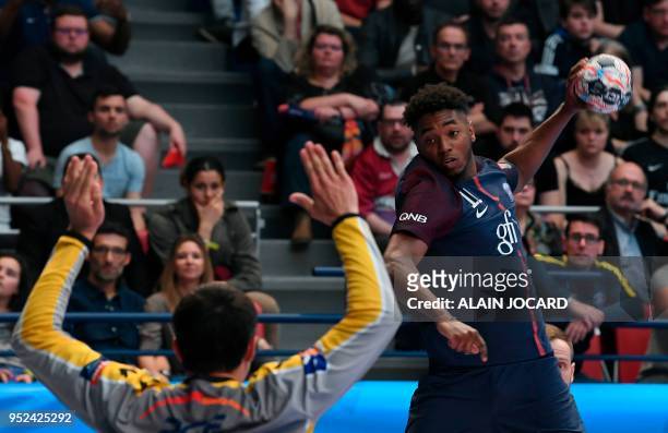 Paris Saint-Germain's Benoit Kounkoud tries to score despite Kielce's goalkeeper Slawomir Szmal during the EHF Champions League quarter-final...