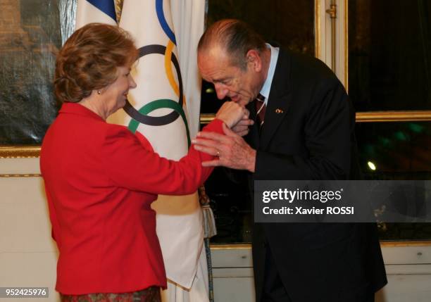 French president Jacques Chirac welcomes Netherland member Els Van Breda Vriesman of The International Olympic Committee inspection panel for the...