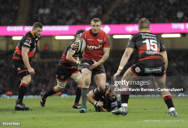 Scarlets' Hadleigh Parkes is tackled by Sarel Pretorius during the Guinness PRO14 Round 21 Judgement Day VI match between Cardiff Blues and Ospreys...