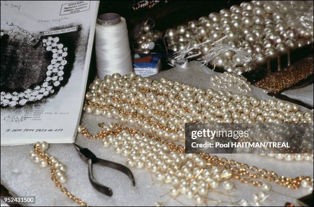 Stringing the celebrated Chanel pearl necklace.