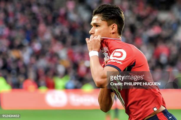 Lille's Brazilian Forward Luiz Araujo celebrates after scoring a goal during the French L1 football match between Lille and Metz on April 28 2018 at...