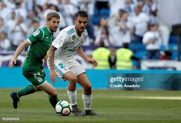 Dani Ceballos of Real Madrid in action against Darko Brasanac of Leganes during La Liga soccer match between Real Madrid and Leganes at Santiago...