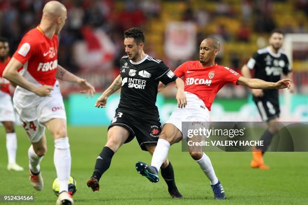 Amiens' French forward Quentin Cornette outruns Monaco's Brazilian defender Fabinho during the French L1 football match Monaco vs Amiens on April 28,...