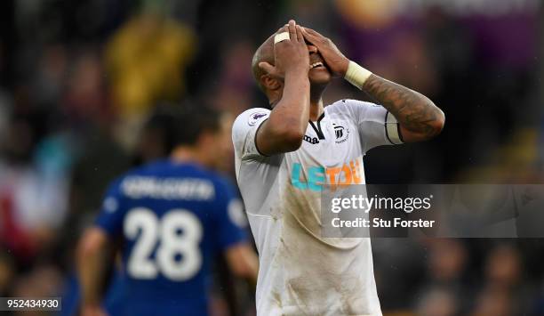 Swansea player Andre Ayew reacts after a chance goes begging during the Premier League match between Swansea City and Chelsea at Liberty Stadium on...