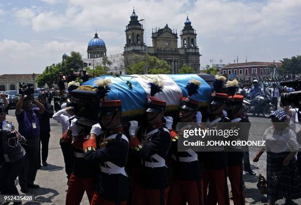 Military personnel carry the coffin of former Guatemalan President and Guatemala City Mayor, Alvaro Arzu, during his funeral at Culture Palace in...