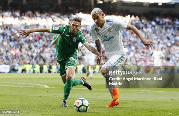 Theo Hernandez of Real Madrid competes for the ball with Joseba Zaldua of Leganes during the La Liga match between Real Madrid and Leganes at Estadio...