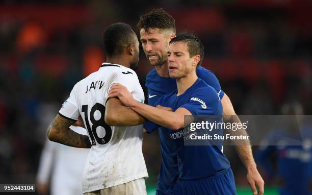 Jordan Ayew of Swansea is seperated from Gary Cahill by his team mate Cesar Azpilicueta after a heated exchange during the Premier League match...