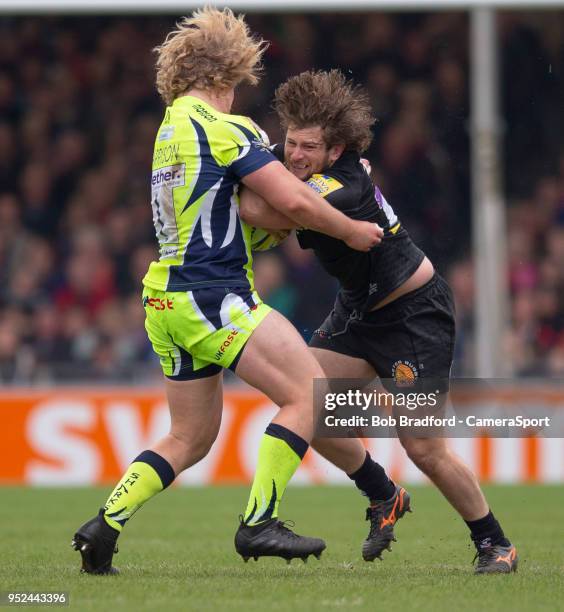 Exeter Chiefs' Alec Hepburn is tackled by Sale Sharks' Ross Harrison during the Aviva Premiership match between Exeter Chiefs and Sale Sharks at...