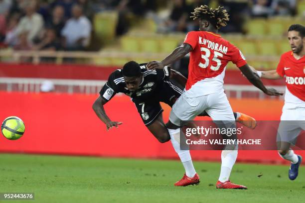 Monaco's French defender Kevin N'Doram vies with Amiens' Congolese - French forward Harrison Manzala during the French L1 football match Monaco vs...