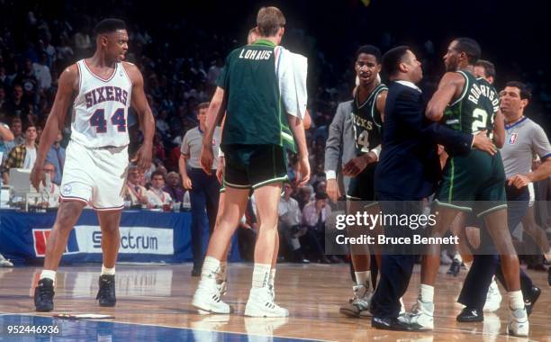 Rick Mahorn of the Philadelphia 76ers gets into a fight with Alvin Robertson of the Milwaukee Bucks during an NBA game on April 30, 1991 at the...