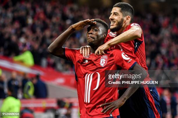 Lille's Ivorian forward Nicolas Pepe celebrates with teammates during the French L1 football match between Lille and Metz on April 28 2018 at the...