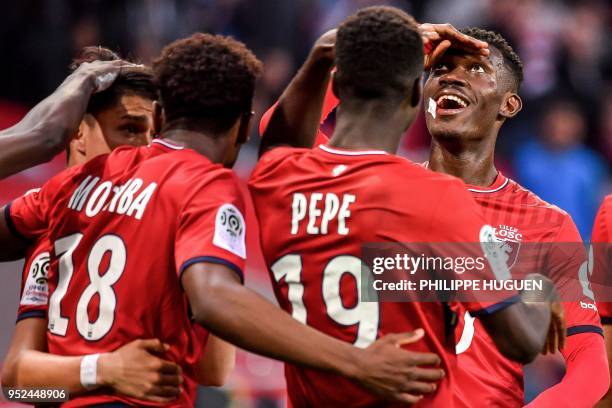 Lille's Ivorian forward Nicolas Pepe celebrates with teammates during the French L1 football match between Lille and Metz on April 28 2018 at the...