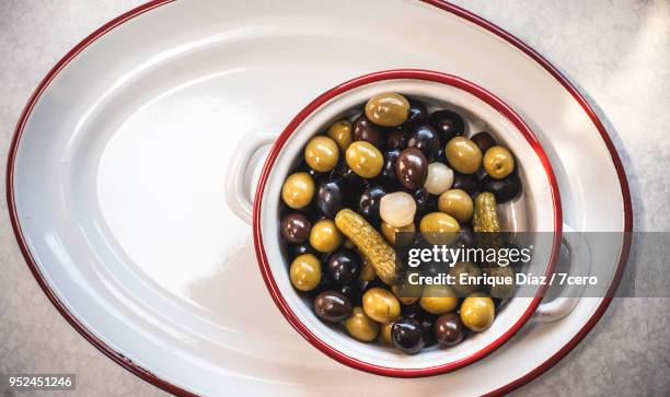 olive cocktail mix in white enamel bowl 3 - 7cero food stock pictures, royalty-free photos & images