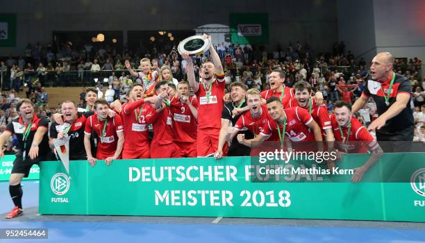 The players of Hohenstein Ernstthal celebrate with the trophy after winning the German Futsal Championship final match between VfL...