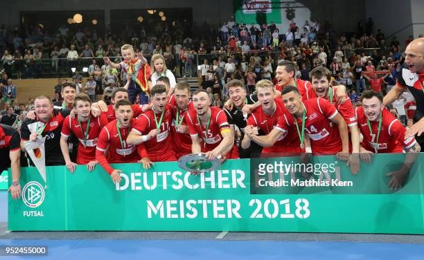 The players of Hohenstein Ernstthal celebrate with the trophy after winning the German Futsal Championship final match between VfL...