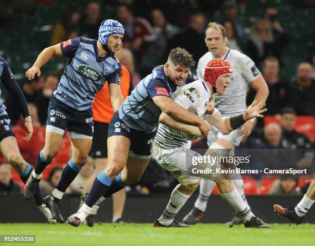 Ospreys' Sam Cross is tackled by Cardiff Blues' Kirby Myhill during the Guinness PRO14 Round 21 Judgement Day VI match between Dragons and Scarlets...