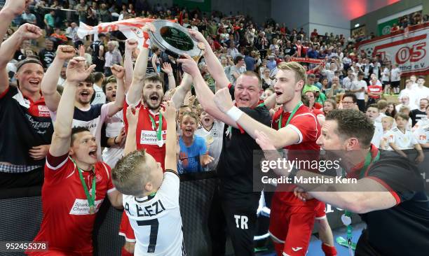 The players of Hohenstein Ernstthal celebrate with the trophy after winning the German Futsal Championship final match between VfL...