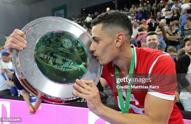 Gabriel Oliviera of Hohenstein Ernstthal kisses the trophy after winning the German Futsal Championship final match between VfL Hohenstein-Ernstthal...