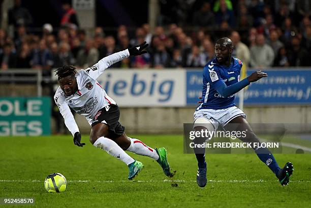 Strasbourg's French defender Ernest Seka vies with Nice's French forward Allan Saint-Maximin during the French L1 football match between Strasbourg...