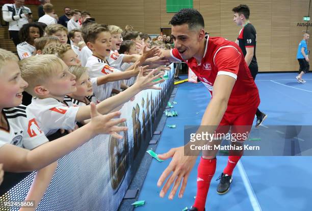 Gabriel Oliviera of Hohenstein Ernstthal celebrates with his supporters after winning the German Futsal Championship final match between VfL...