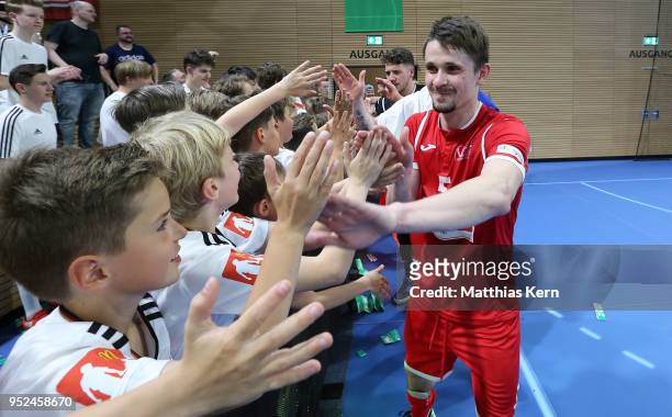 Jurii Melnyk of Hohenstein Ernstthal celebrates with his supporters after winning the German Futsal Championship final match between VfL...