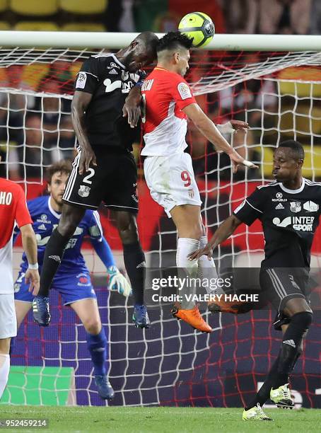 Monaco's Colombian forward Radamel Falcao vies with Amiens' Prince Desir Gouano during the French L1 football match Monaco vs Amiens on April 28,...