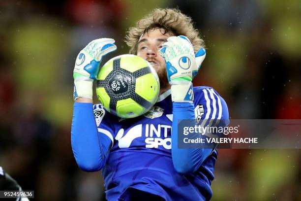 Amiens' French goalkeeper Regis Gurtner stops the ball during the French L1 football match Monaco vs Amiens on April 28, 2018 at the "Louis II...