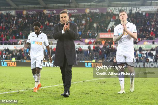 Swansea City manager Carlos Carvalhal and Alfie Mawson of Swansea City after the final whistle of the Premier League match between Swansea City and...