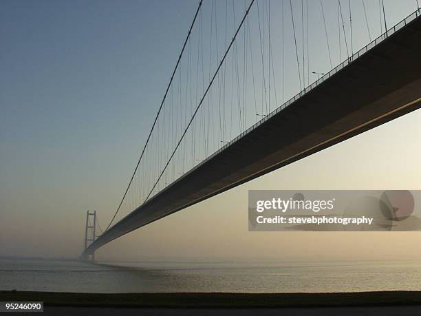 humber bridge at sunset - bridging the gap stock pictures, royalty-free photos & images