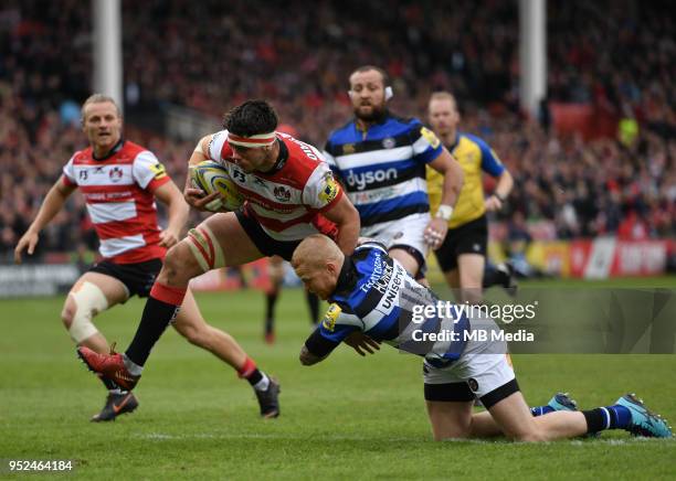 Gloucester's Lewis Ludlow is tackled by Bath Rugby's Tom Homer during the Aviva Premiership match between Gloucester Rugby and Bath Rugby at...