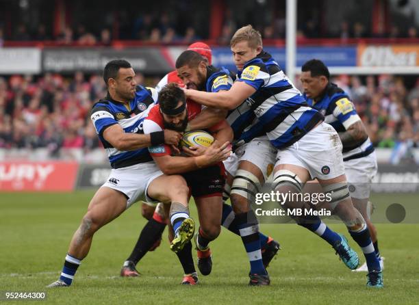 Gloucester's James Hanson is tackled by Bath Rugby's Kahn Fotuali'i and Tom Ellis during the Aviva Premiership match between Gloucester Rugby and...