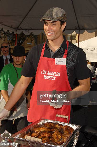 Actor Victor Webster volunteers at the Los Angeles Mission Christmas Eve meal on December 24, 2009 in Los Angeles, California.