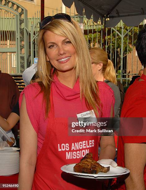 Actress Courtney Hansen volunteers at the Los Angeles Mission Christmas Eve meal on December 24, 2009 in Los Angeles, California.