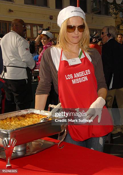 Actress Victoria Pratt volunteers at the Los Angeles Mission Christmas Eve meal on December 24, 2009 in Los Angeles, California.