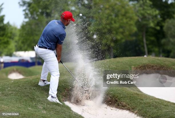 Scott Brown plays a shot from a bunker on the eighth hole during the third round of the Zurich Classic at TPC Louisiana on April 28, 2018 in...