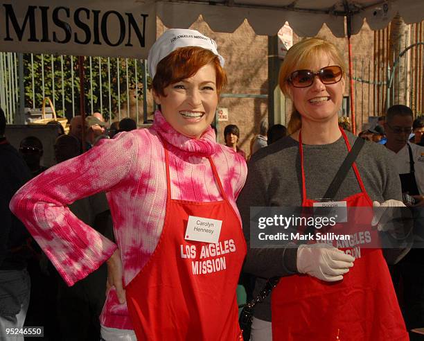 Actresses Carolyn Hennesy and Bonnie Hunt volunteer at the Los Angeles Mission Christmas Eve meal on December 24, 2009 in Los Angeles, California.