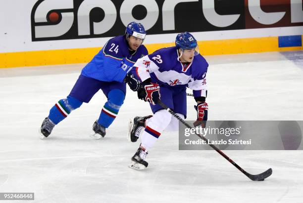 Luca Felicetti of Italy challenges Paul Swindlehurst of Great Britain during the 2018 IIHF Ice Hockey World Championship Division I Group A match...