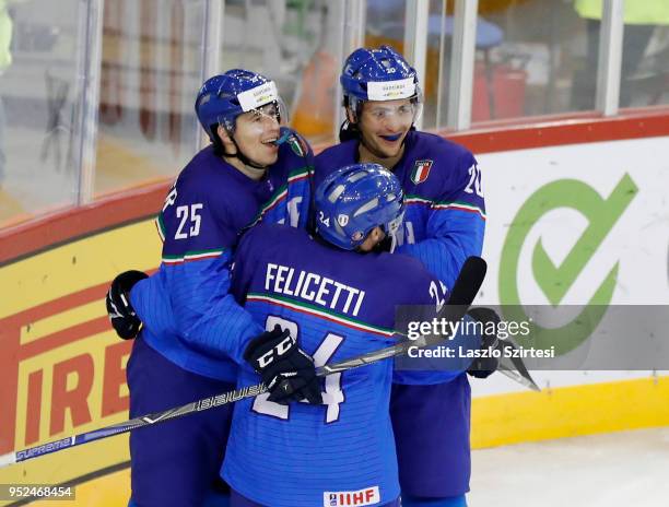 Alex Lambacher of Italy, Luca Felicetti of Italy and Ivan Deluca of Italy celebrate the first Italian score during the 2018 IIHF Ice Hockey World...