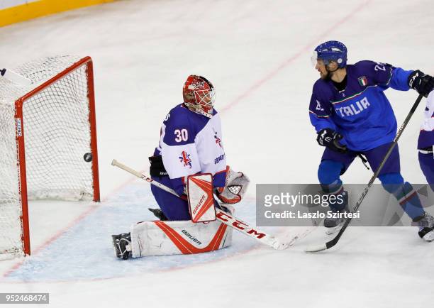 Goalie Ben Bowns of Great Britain cannot save next to Tommaso Goi of Italy during the 2018 IIHF Ice Hockey World Championship Division I Group A...