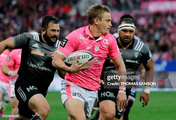 Stade Francais' French fly-half Jules Plisson runs to score a try during the French Top 14 rugby union match between Paris Stade Francais and Brive...