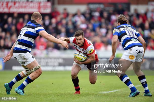 Gloucester's Henry Trinder evades the tackle of Bath Rugby's Tom Ellis during the Aviva Premiership match between Gloucester Rugby and Bath Rugby at...